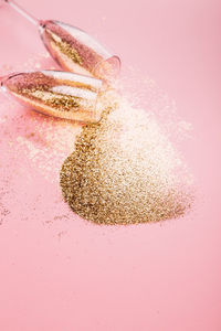 High angle view of coffee beans against colored background