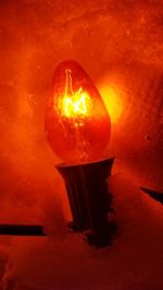 Close-up of illuminated light bulb