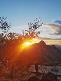 Scenic view of mountains against sky during sunset