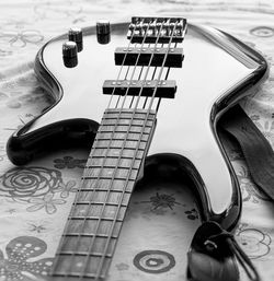 High angle view of guitar on table