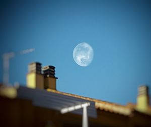 Low angle view of moon against sky at night