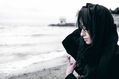 Woman standing at beach