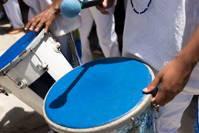 Musicians from the group filhos de gandhy are seen playing percussion during a tribute  santa luzia 