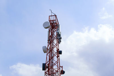 Low angle view of electricity pylon against sky