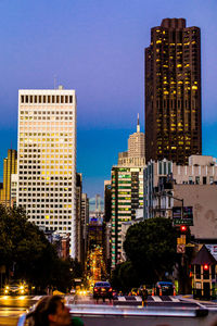 City street and modern buildings against sky