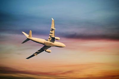 Low angle view of airplane flying in sky