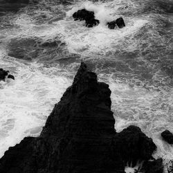 High angle view of rock formation in sea