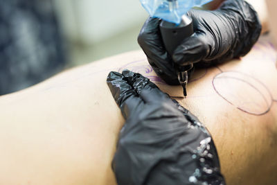 Low section of man sitting on floor