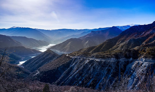 Scenic view of snowcapped mountains against sky