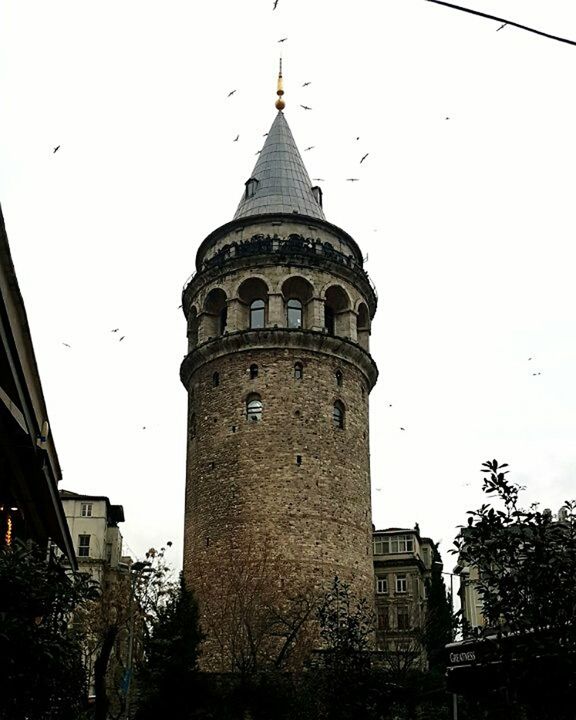 architecture, built structure, tower, building exterior, low angle view, no people, history, sky, outdoors, day, clock, clock tower, clock face