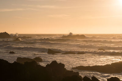 Scenic view of sea against sky during sunset