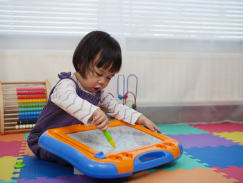 Cute toddler girl playing at home