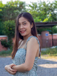 A asian nationality thai woman wearing blue dress and feel good