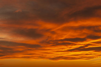 Low angle view of dramatic sky during sunset