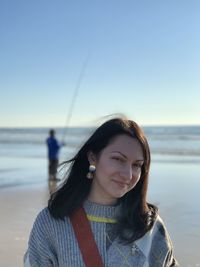 A relaxed girl in porto by the ocean enjoying the moment. happy young woman. dreamy mood