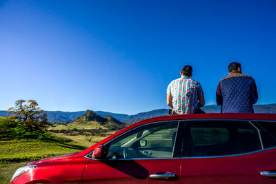 Rear view of people traveling in car