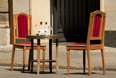 Table by chairs on street