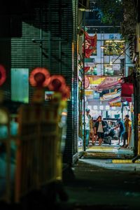 People walking on street at night