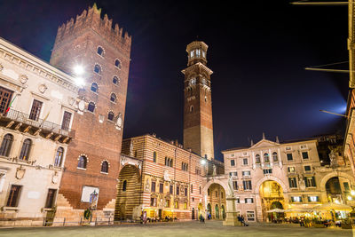 Low angle view of illuminated buildings at night