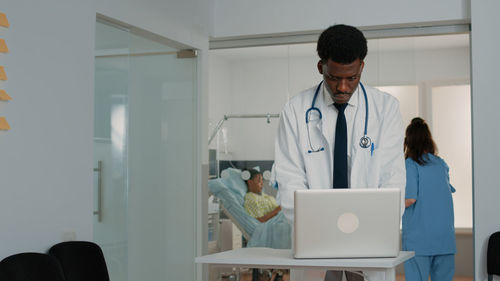 Female doctor working in office