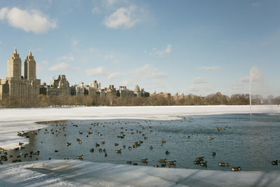 View of city during winter against sky