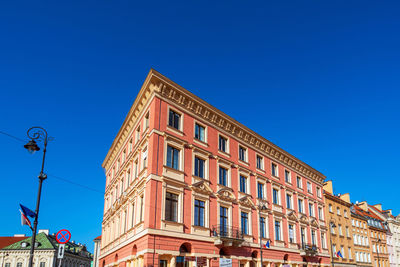 Low angle view of building against clear blue sky