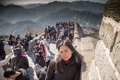 Woman standing on great wall of china