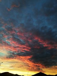 Low angle view of dramatic sky during sunset