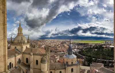 Buildings in city against sky