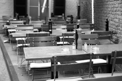 Empty chairs and tables in restaurant