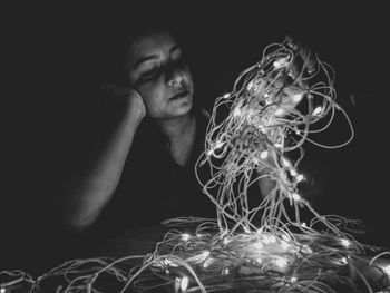 Close-up of man against black background