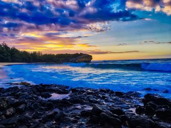 Scenic view of sea against cloudy sky