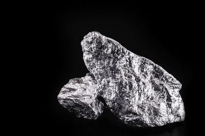 Close-up of rock against black background