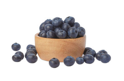 Close-up of blueberries against white background