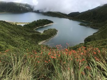 Scenic view of lake and mountains against sky