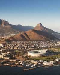 High angle shot of town against mountains