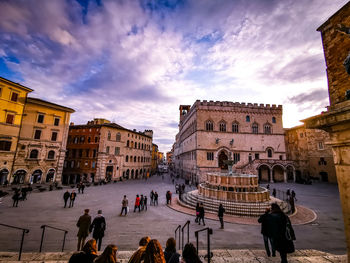 Group of people in front of buildings