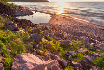 High angle view of rocks on beach against sky