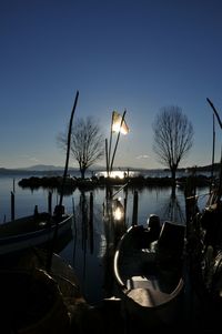 Sailboats in sea against clear sky