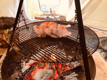 High angle view of meat on barbecue grill