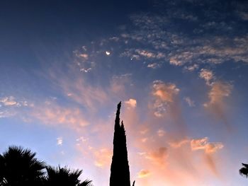 Low angle view of silhouette trees against sky during sunset