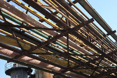 Low angle view of metallic structure against sky