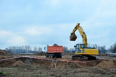 Construction site on field against sky