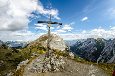 Scenic view of mountains against cloudy sky