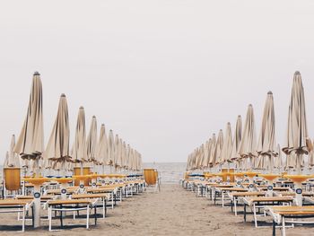 View of empty chairs on beach