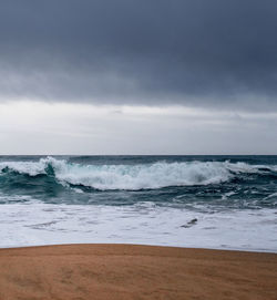 Scenic view of beach against sky