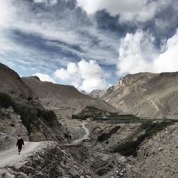 Rear view of woman on walkway against pamir mountains
