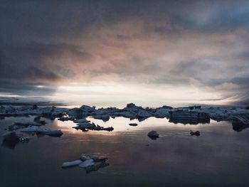 Scenic view of sea against cloudy sky