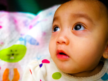 Close-up portrait of cute baby at home