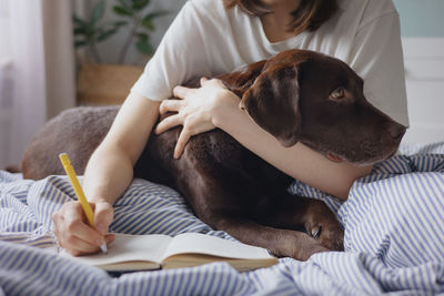 Midsection of woman with dog